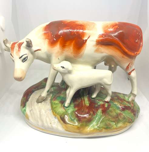 Pair 19thC Staffordshire Cow Figures